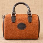 CARTERA BAÚL DE CUERO CARPINCHO