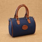 CARTERA BAÚL DE CUERO